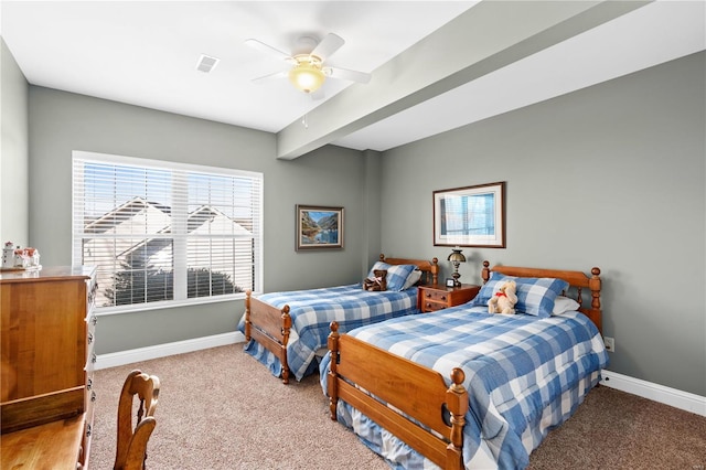 bedroom with ceiling fan, beam ceiling, and carpet floors