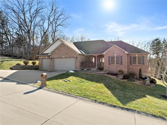 ranch-style home with a garage and a front yard