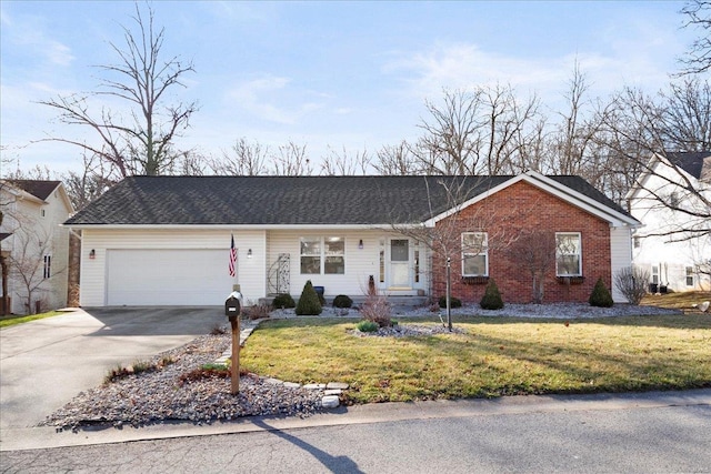 ranch-style house featuring brick siding, a garage, driveway, and a front lawn