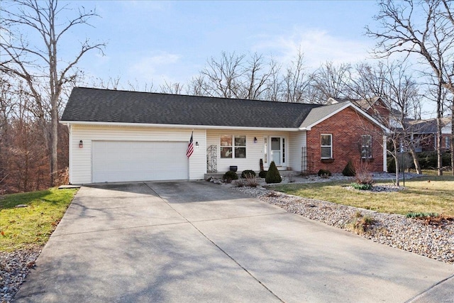 single story home with concrete driveway, an attached garage, and brick siding