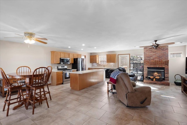 interior space with recessed lighting, a fireplace, and ceiling fan