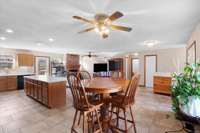 dining space with visible vents, a brick fireplace, ceiling fan, recessed lighting, and light tile patterned flooring