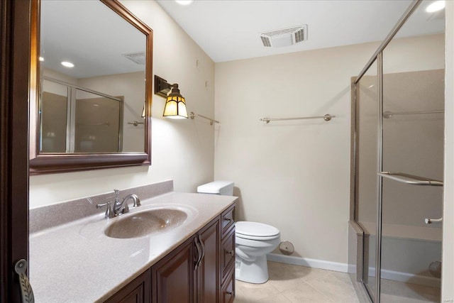 bathroom featuring visible vents, toilet, a stall shower, and vanity