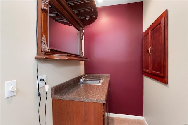 interior space featuring baseboards and vanity