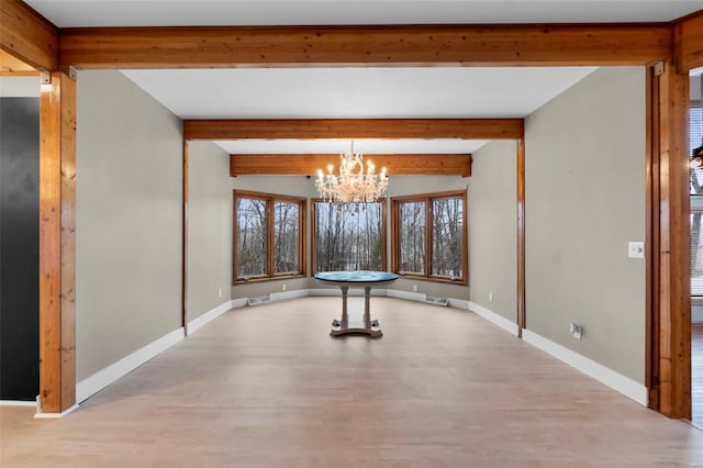 unfurnished dining area featuring beam ceiling and a chandelier