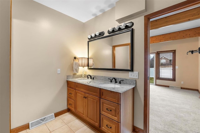 bathroom with vanity and tile patterned flooring