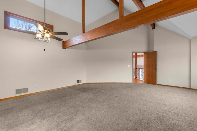 spare room featuring beamed ceiling, ceiling fan, carpet floors, and high vaulted ceiling