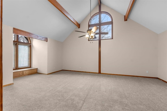 additional living space featuring beamed ceiling, light carpet, a wealth of natural light, and high vaulted ceiling