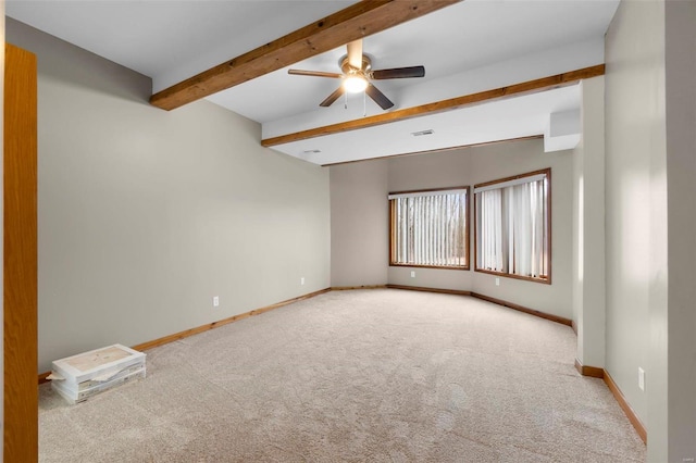 carpeted spare room with beam ceiling and ceiling fan