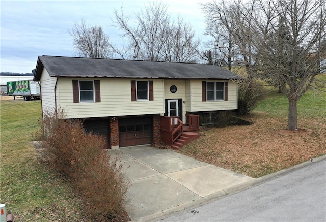 raised ranch with a garage and a front lawn