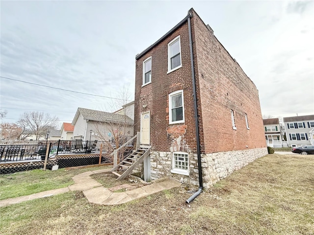 view of home's exterior featuring a yard and a deck