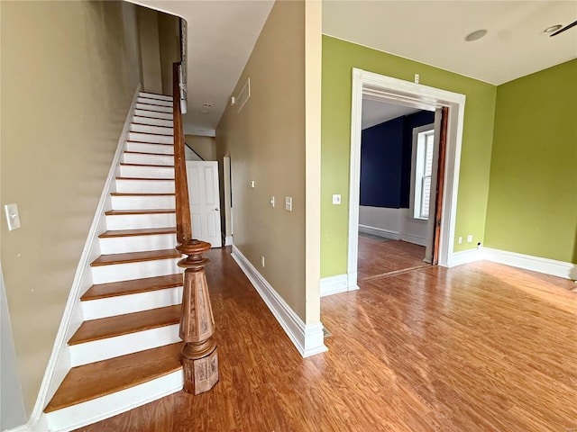 stairway featuring hardwood / wood-style flooring