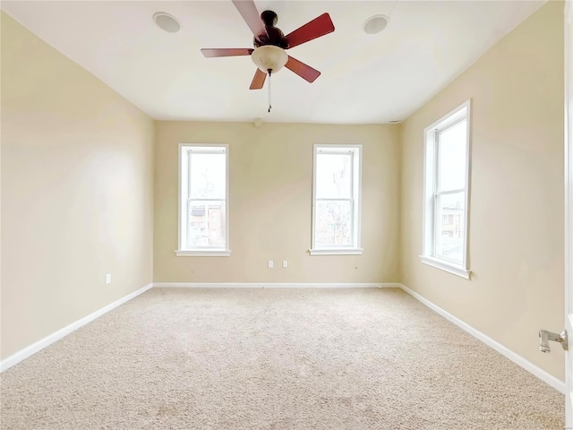 empty room with carpet floors and ceiling fan