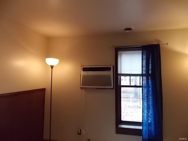 interior space featuring a wall mounted air conditioner