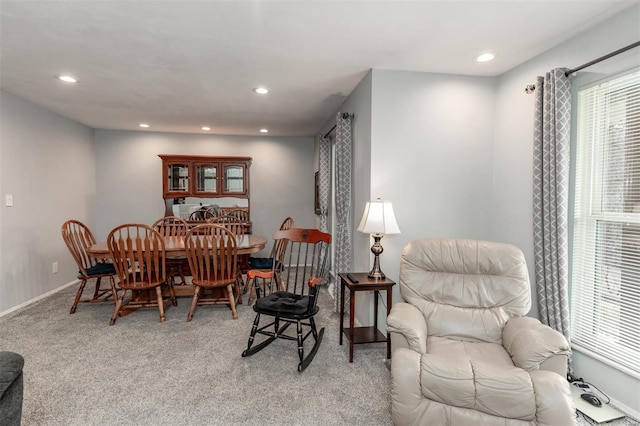 dining room featuring light colored carpet