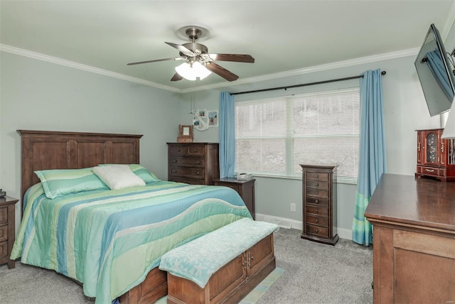 bedroom featuring crown molding, light colored carpet, and ceiling fan