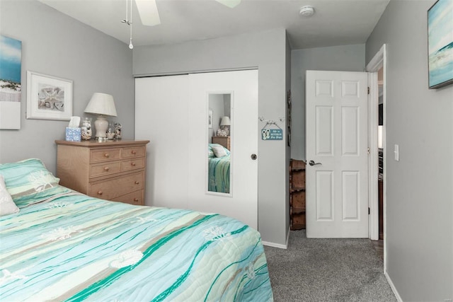 carpeted bedroom with ceiling fan and a closet