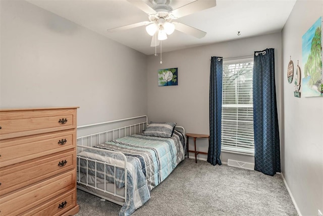 carpeted bedroom featuring ceiling fan