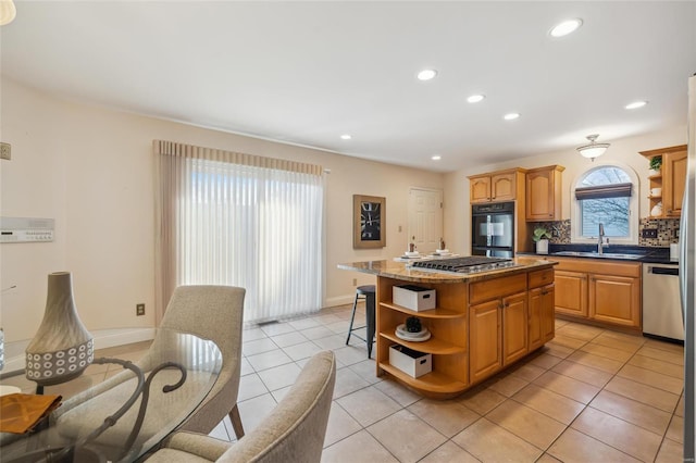 kitchen with a kitchen island, open shelves, a sink, decorative backsplash, and stainless steel appliances