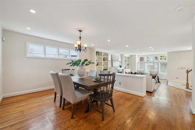 dining room featuring recessed lighting, baseboards, and light wood-style floors