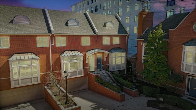 view of front of house featuring brick siding