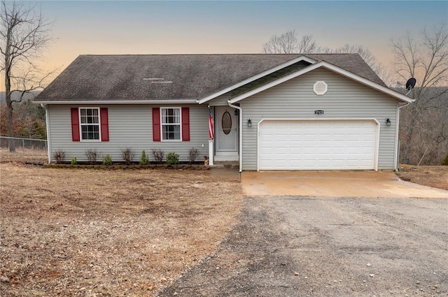 single story home with a garage