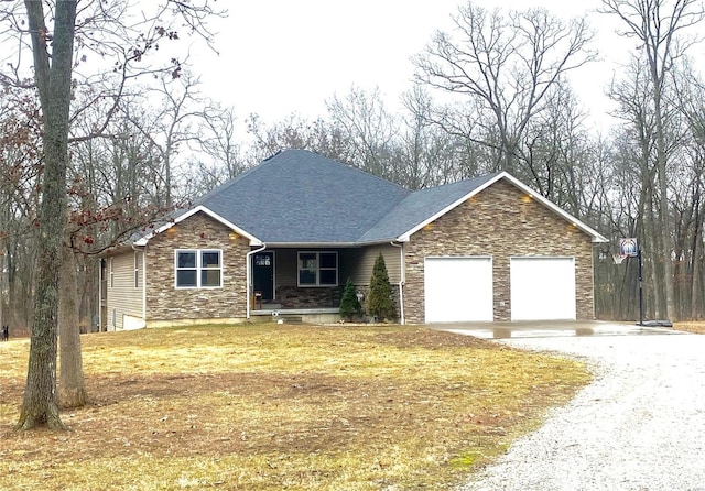 ranch-style home with a garage, a shingled roof, stone siding, gravel driveway, and a front lawn