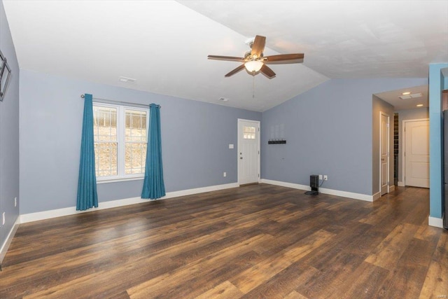 unfurnished living room featuring dark wood-type flooring, ceiling fan, and lofted ceiling