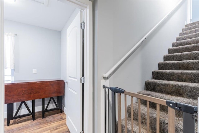 stairway with wood-type flooring