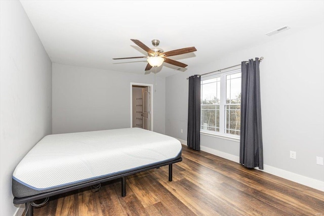 bedroom featuring dark hardwood / wood-style floors and ceiling fan