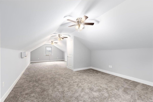 bonus room with lofted ceiling, ceiling fan, and carpet