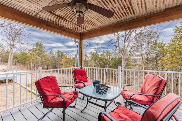 wooden deck featuring ceiling fan