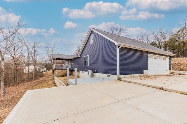 view of property exterior featuring a garage