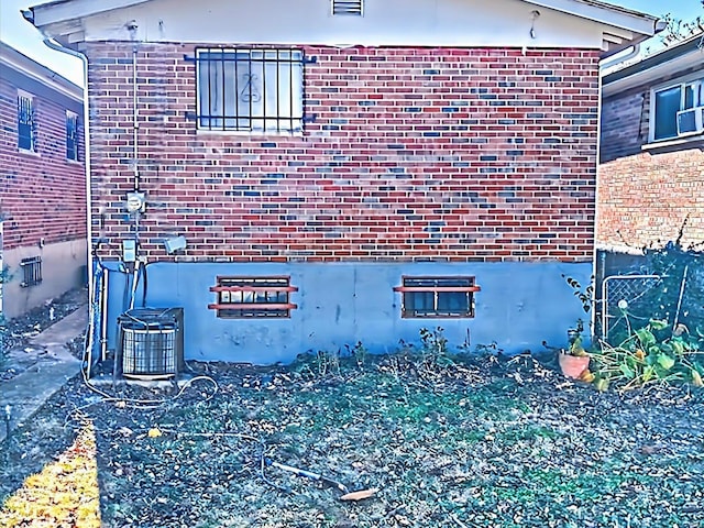 view of side of home featuring central air condition unit