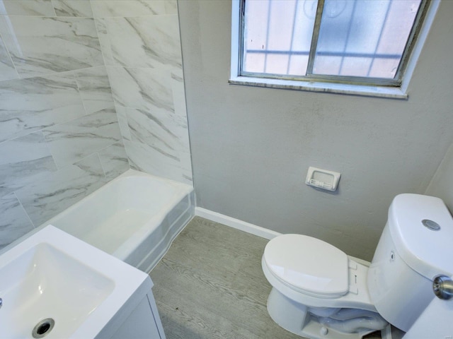 bathroom with hardwood / wood-style floors and toilet