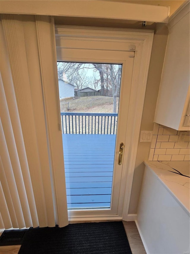 doorway featuring hardwood / wood-style floors