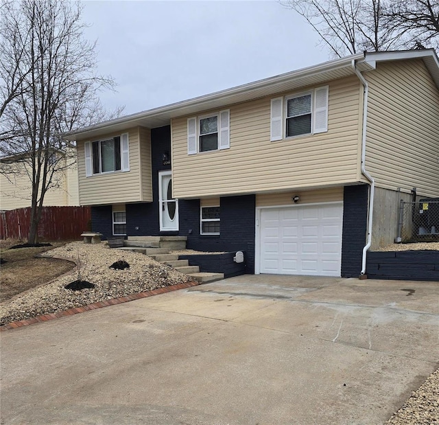 bi-level home featuring a garage