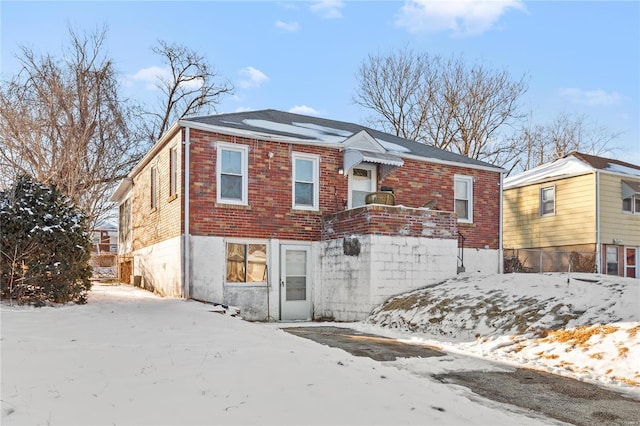 view of front of property featuring brick siding