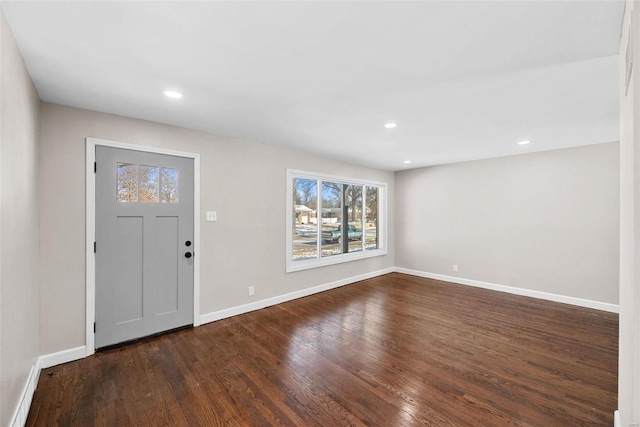 entryway with dark wood-style floors, baseboards, and recessed lighting