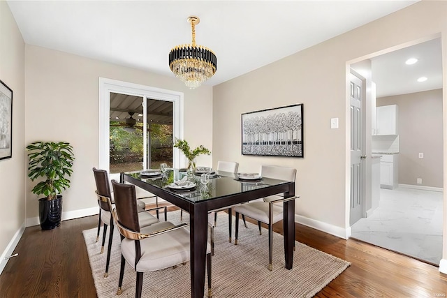 dining room featuring baseboards, a chandelier, wood finished floors, and recessed lighting