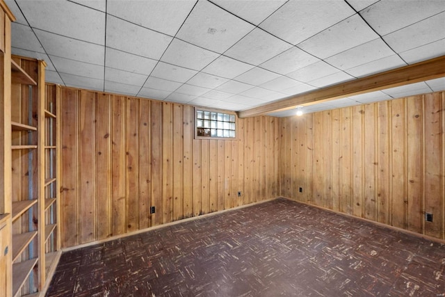 below grade area featuring wooden walls