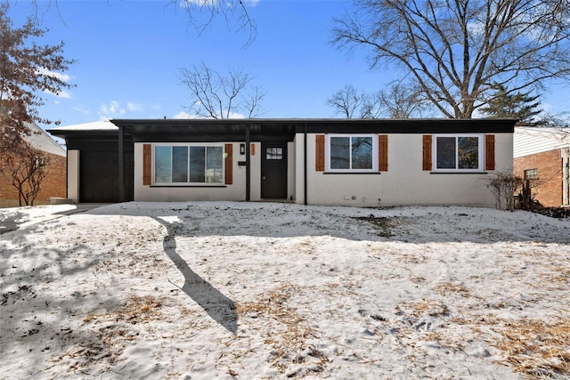 view of front of property with brick siding and an attached garage