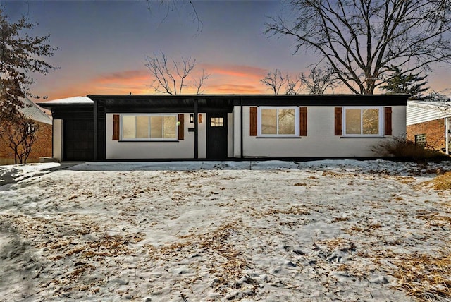 mid-century inspired home with a garage