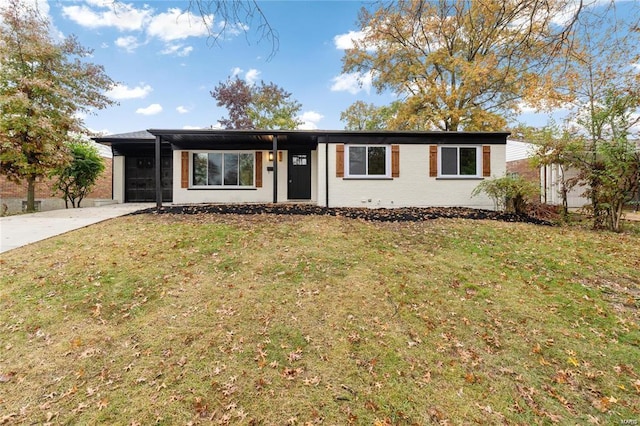 single story home with a front yard and concrete driveway