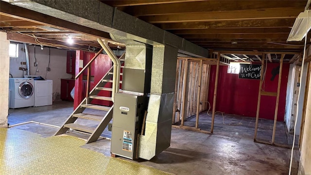 basement with heating unit and independent washer and dryer