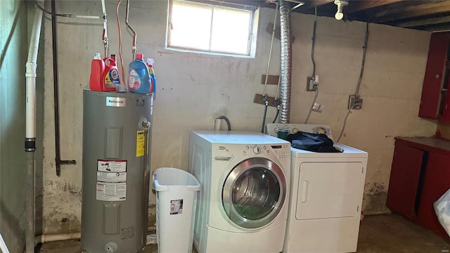 laundry room with electric water heater and washing machine and dryer