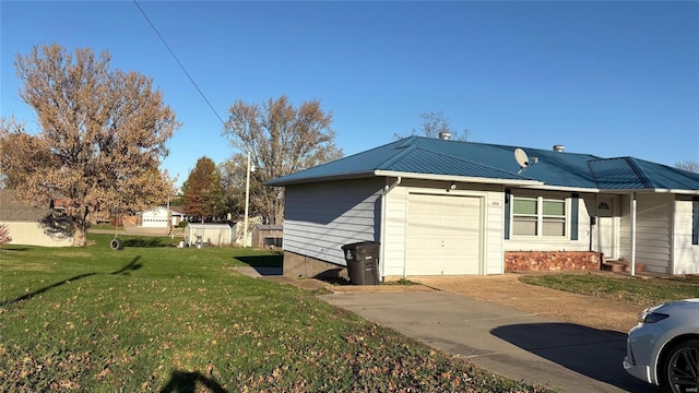 view of side of home featuring a lawn and a garage