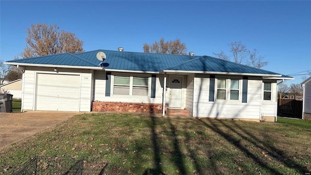 single story home featuring a front lawn and a garage