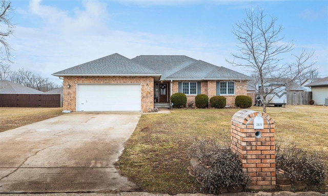 single story home with a garage and a front lawn