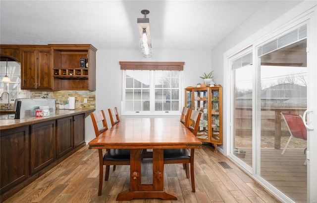 dining area featuring light wood-type flooring